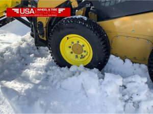 Role of Tire Service in Skid Loader Snow Tires